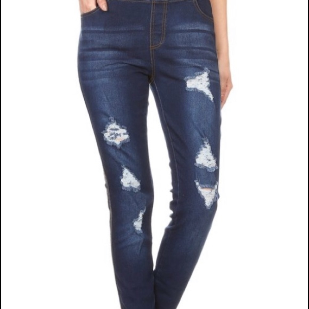 Distressed jeans with elastic waist band.
